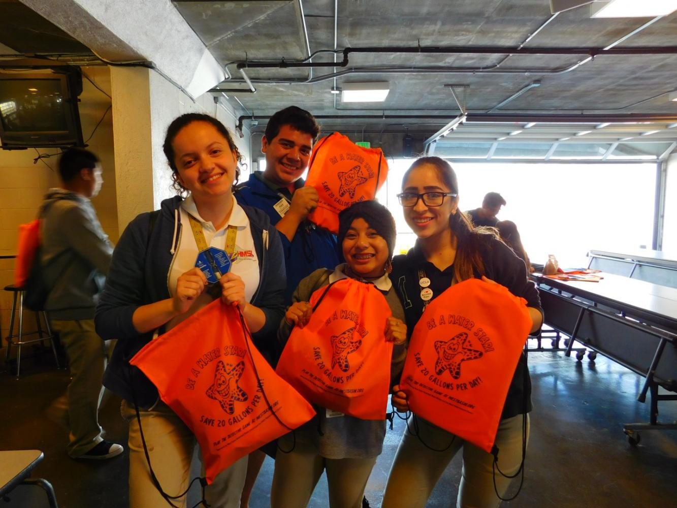 Students receive Water Basin bags. 