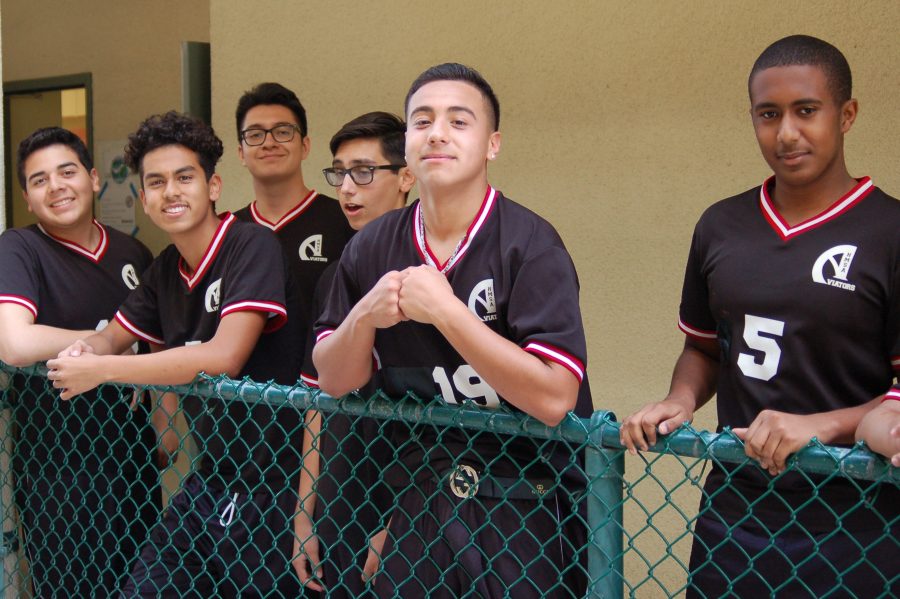 The boys volleyball team get ready for pep rally. 