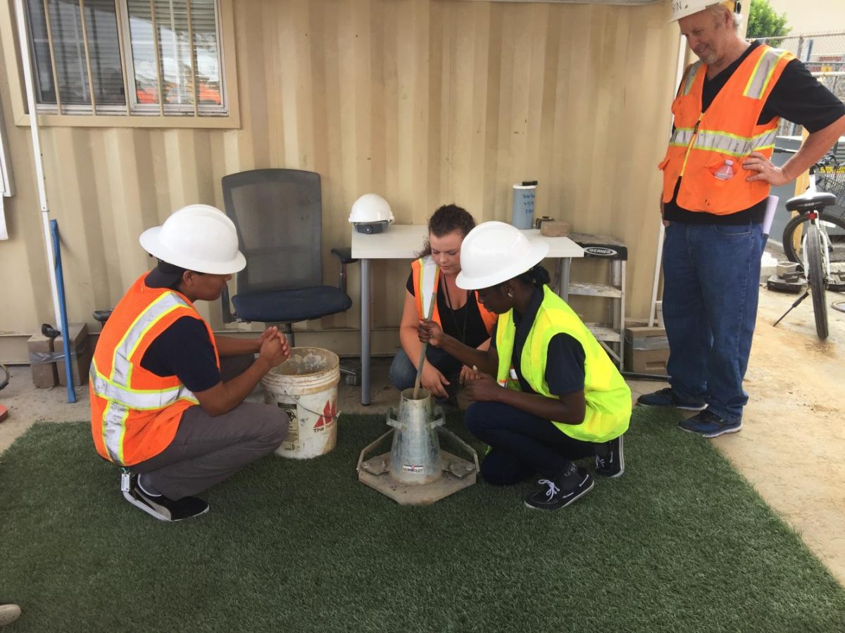 The Boring Company staff showed the students the process of checking the consistency of the dirt. 