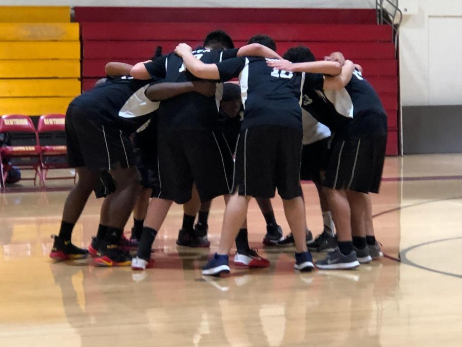 HMSAs boys volleyball team doing their cheer before starting their game (Photo Source: Pedro Adame).