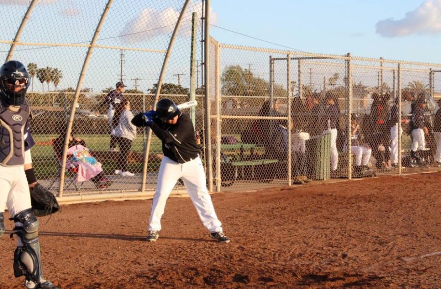Eric G. in position for batting in their baseball game against New Roads ( Photo Source: Pedro Adame).