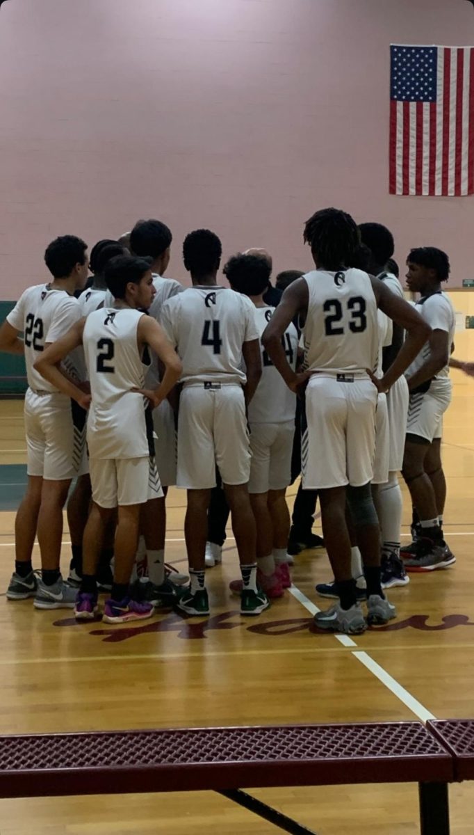 The boys Varsity are gearing up for their games as their coach offers final words of advice (Photo source: Chika Chukwuma Orakwe and Mostafa Elsharaway).