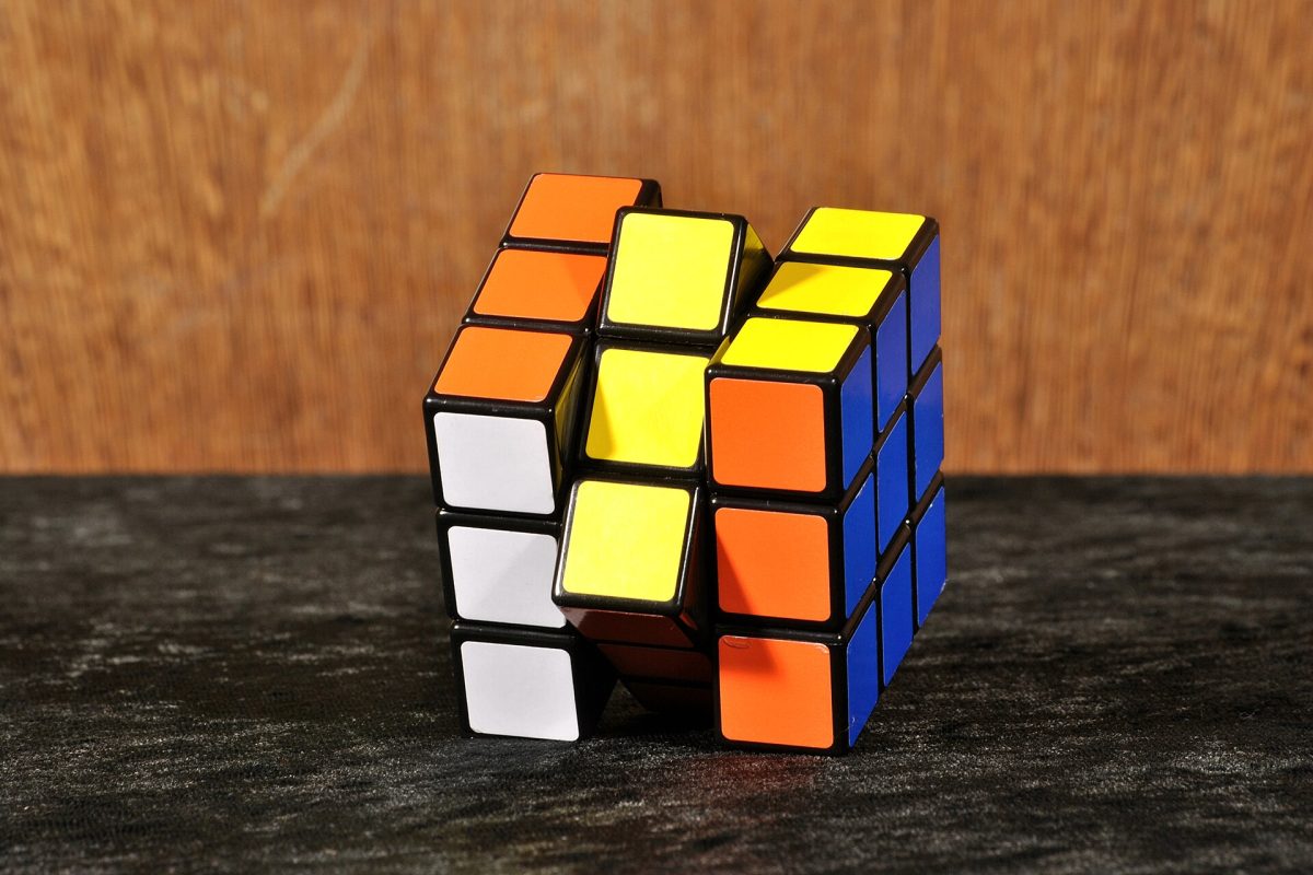A Rubik's Cube, also known as a Magic Cube, sits against a plain background. The classic puzzle toy has challenged problem-solvers since its invention in 1974. (Kaʁstn / Wikimedia Commons)